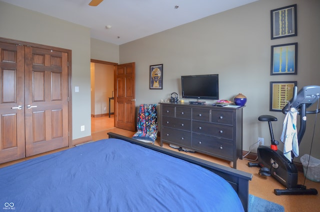 bedroom featuring ceiling fan and carpet floors