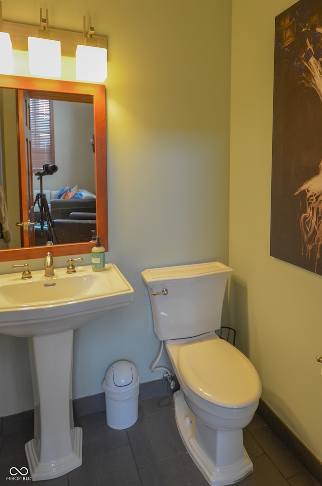 bathroom featuring tile patterned flooring and toilet