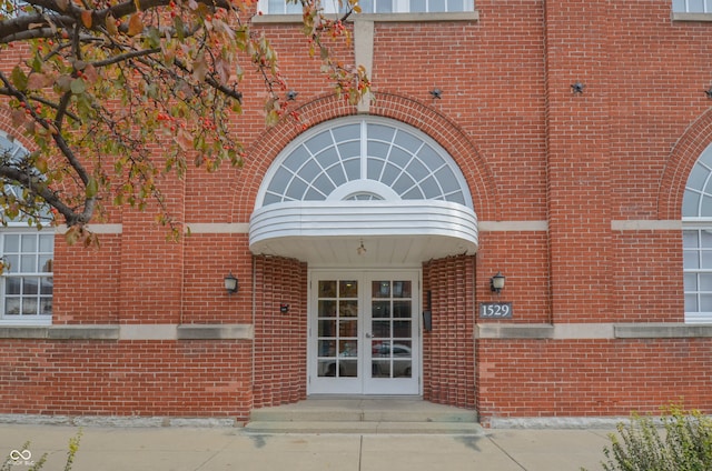 view of exterior entry featuring french doors