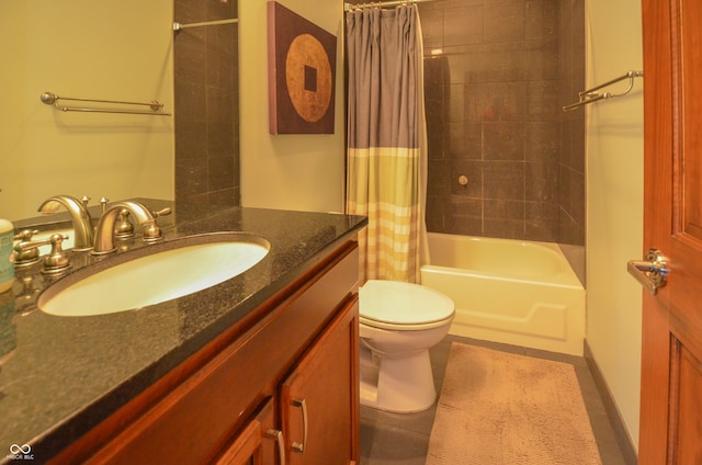 full bathroom featuring shower / bath combo with shower curtain, tile patterned floors, toilet, and vanity