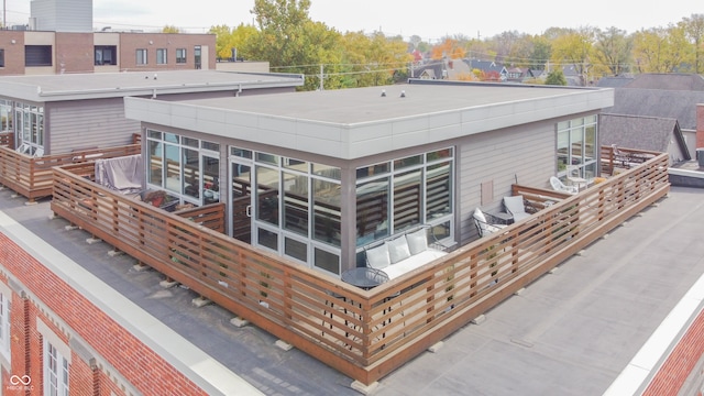 rear view of property featuring a balcony