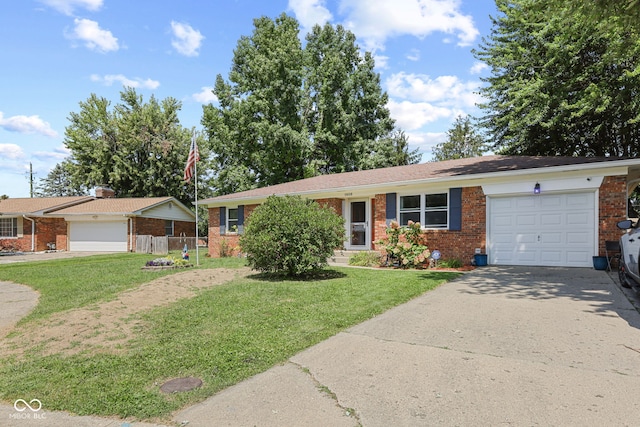 single story home featuring a garage and a front yard