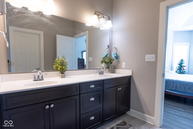 bathroom featuring a wealth of natural light, vanity, and hardwood / wood-style flooring