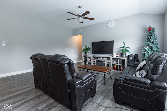 living room featuring ceiling fan, hardwood / wood-style flooring, and vaulted ceiling