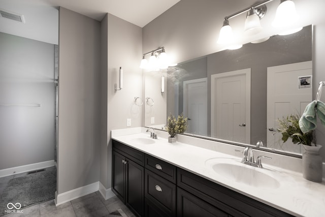 bathroom with vanity and tile patterned flooring