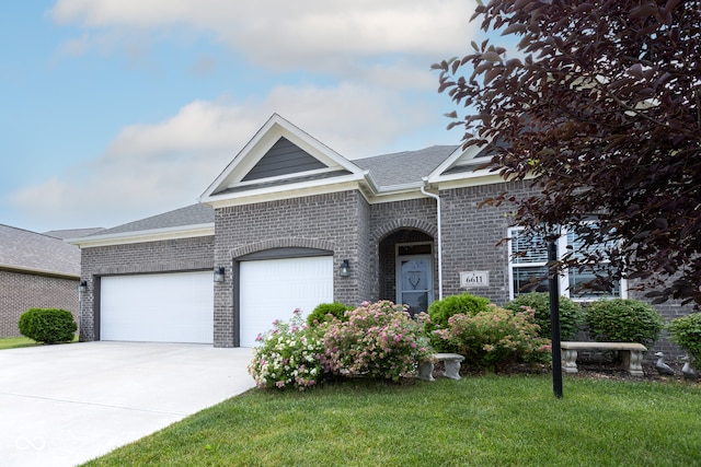 view of front of home featuring a garage and a front yard