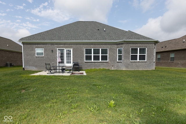 back of house with a yard, cooling unit, and a patio area