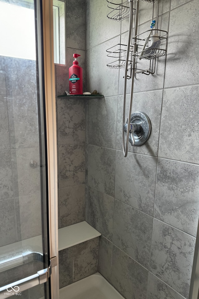 bathroom with tiled shower