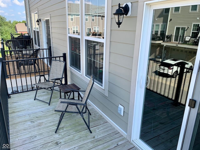 wooden balcony featuring a wooden deck