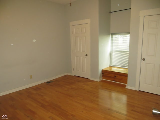 unfurnished bedroom featuring wood-type flooring