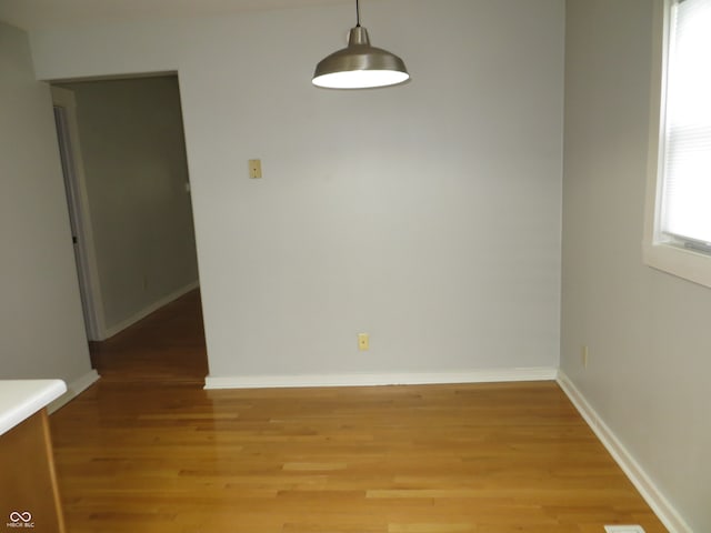 spare room featuring hardwood / wood-style floors