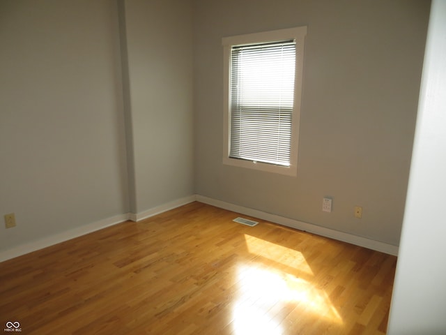 unfurnished room featuring light hardwood / wood-style flooring