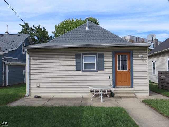 rear view of property featuring a patio area