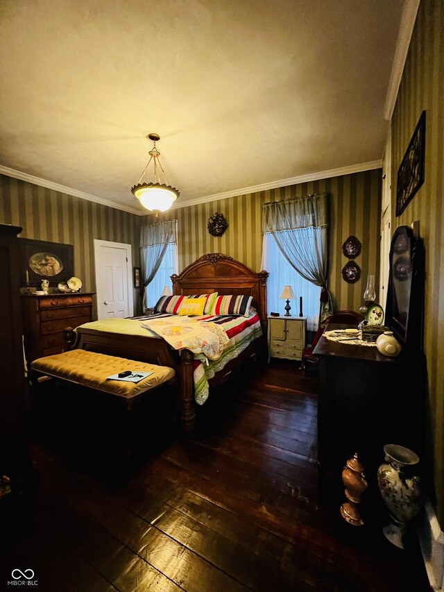 bedroom with wallpapered walls, crown molding, and hardwood / wood-style floors