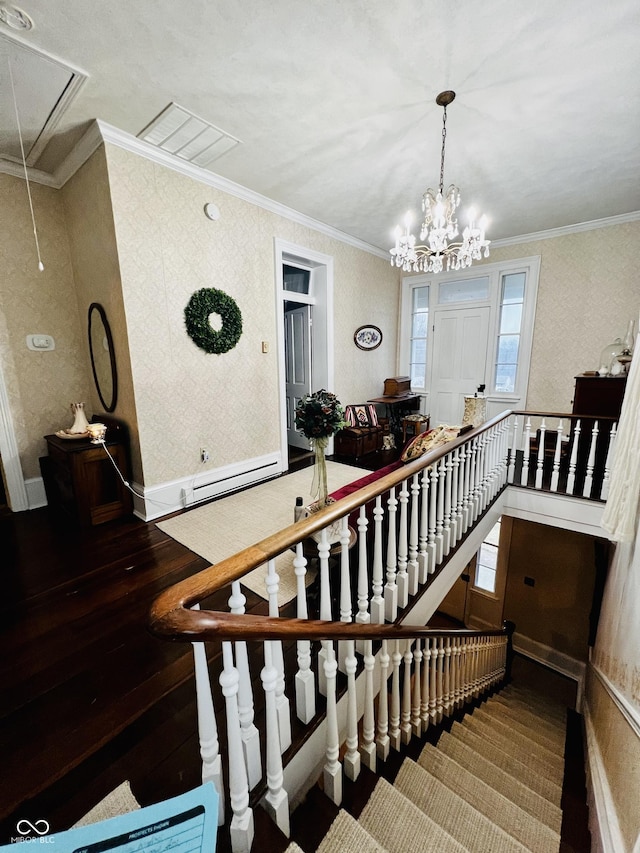 stairway with wallpapered walls, attic access, wood finished floors, and crown molding