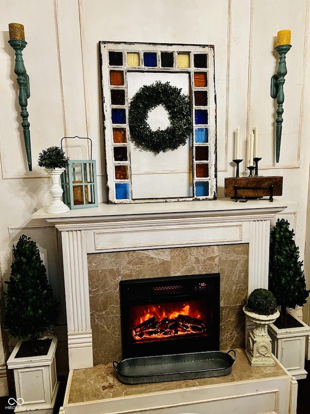 interior details with a tile fireplace