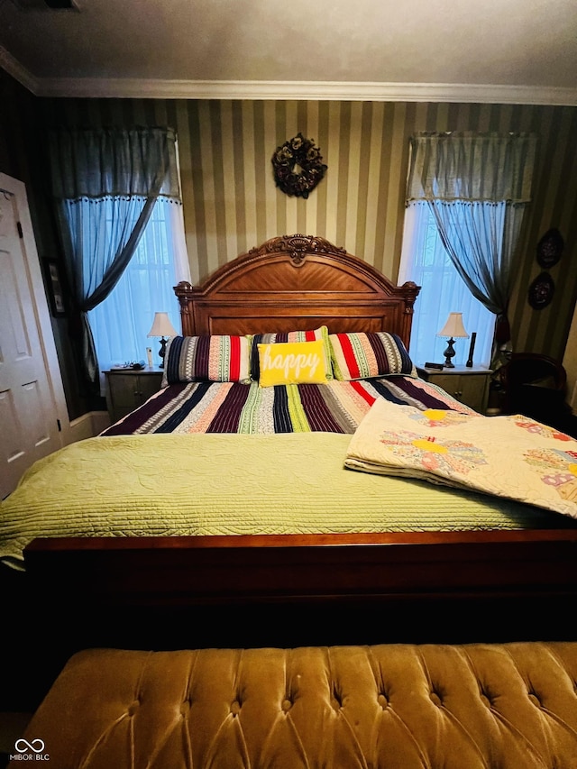 bedroom featuring wallpapered walls and ornamental molding