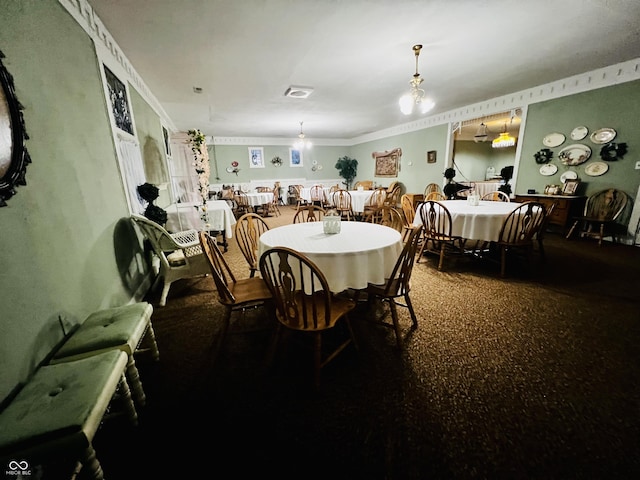 dining room featuring crown molding and visible vents