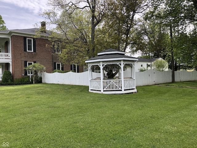 view of yard featuring a gazebo and fence