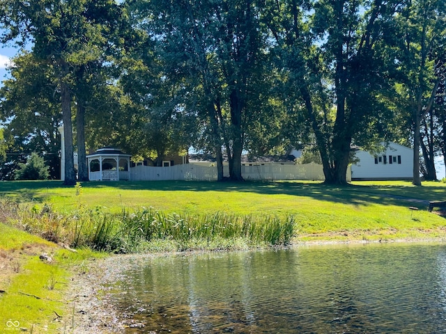 property view of water featuring a gazebo and fence