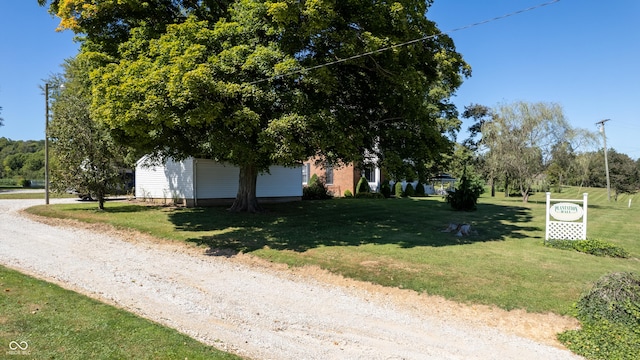 view of road with driveway