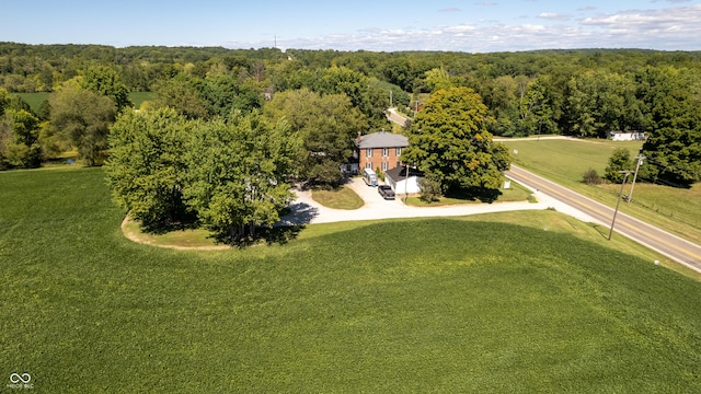 drone / aerial view featuring a view of trees