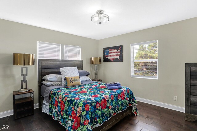 bedroom featuring dark hardwood / wood-style flooring