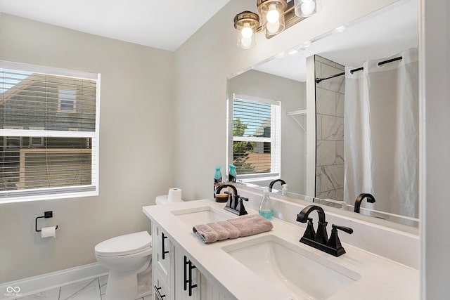 bathroom with vanity, toilet, and a shower with curtain