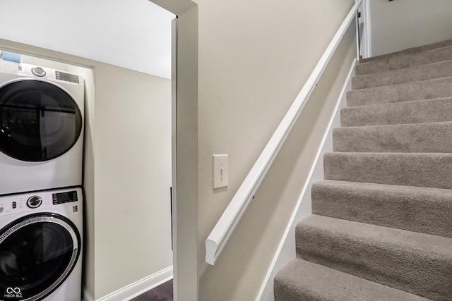 laundry room with stacked washer / drying machine