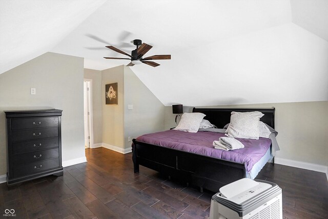 bedroom featuring vaulted ceiling, ceiling fan, and dark hardwood / wood-style floors