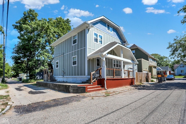 view of front facade with a residential view and board and batten siding