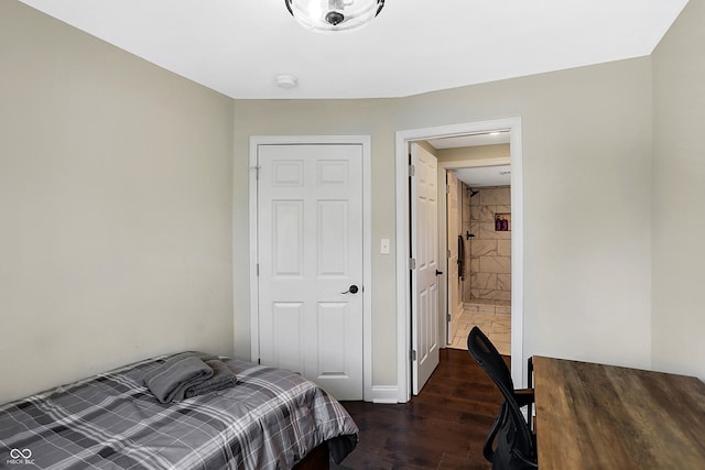 bedroom with dark wood finished floors