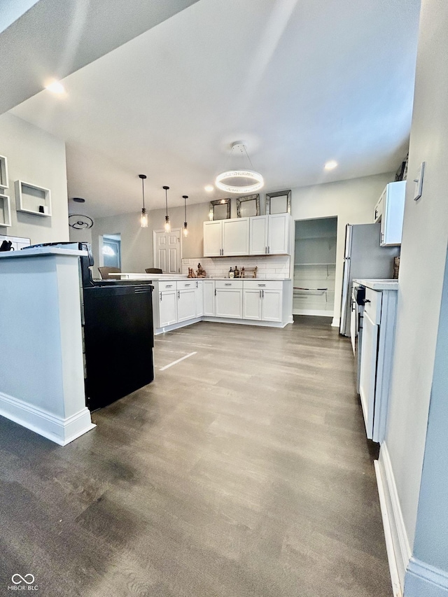 1938 E 11th St, Indianapolis, IN 46201 - kitchen with baseboards, white cabinets, decorative light fixtures, wood finished floors, and recessed lighting