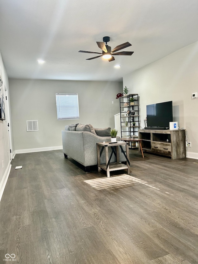 1938 E 11th St, Indianapolis, IN 46201 - living room featuring a ceiling fan, wood finished floors, and baseboards