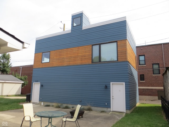 back of property featuring a patio area