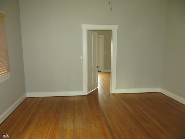 unfurnished room featuring wood-type flooring