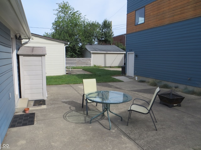 view of patio / terrace featuring an outbuilding and a garage