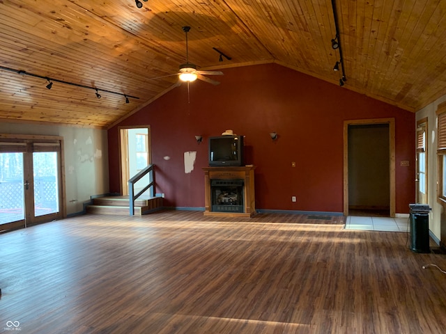 unfurnished living room featuring lofted ceiling, track lighting, hardwood / wood-style flooring, and wooden ceiling