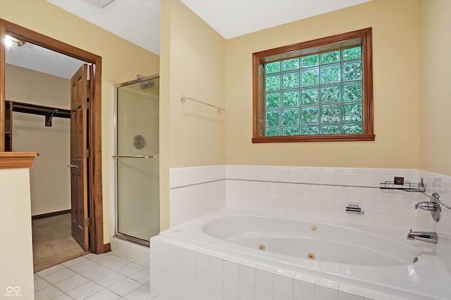 bathroom with tile patterned floors and independent shower and bath