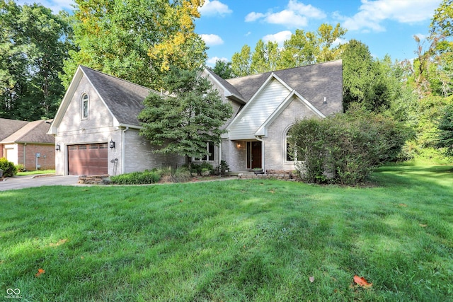 view of front facade with a front lawn and a garage