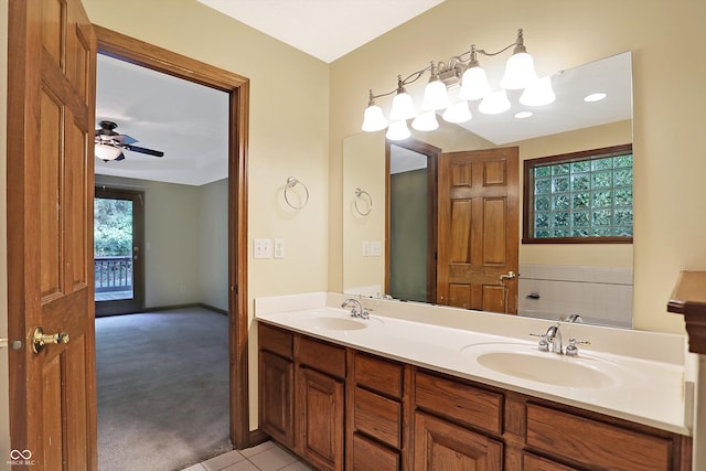 bathroom featuring tile patterned flooring, vanity, ceiling fan, and a healthy amount of sunlight