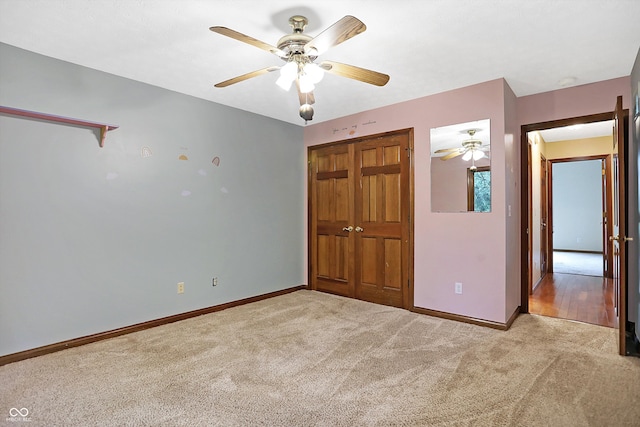 unfurnished bedroom with light carpet, a closet, and ceiling fan