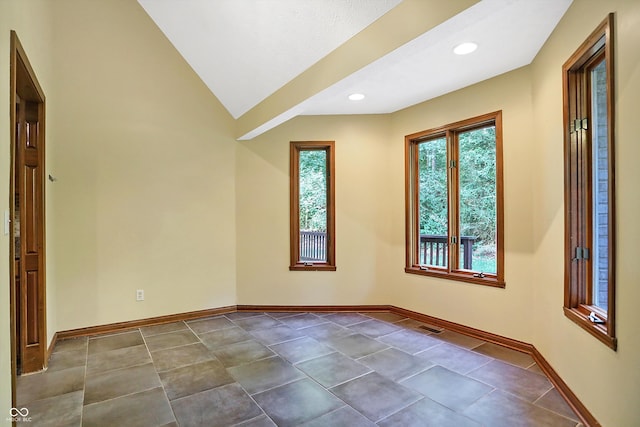 empty room with vaulted ceiling