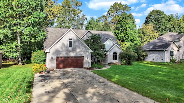 view of front of house with a front lawn and a garage