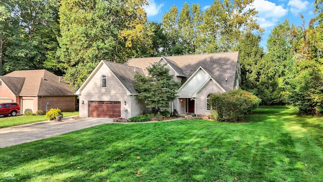 view of front facade featuring a garage and a front lawn