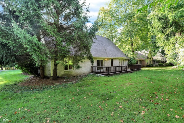 view of yard with a wooden deck