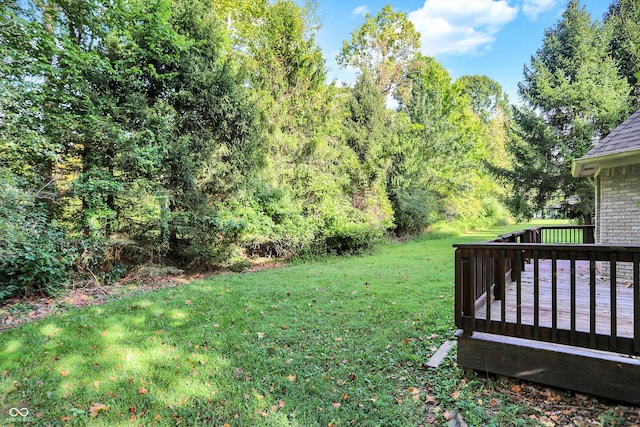 view of yard with a wooden deck