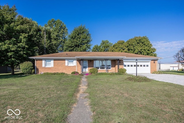 ranch-style house with a garage and a front lawn