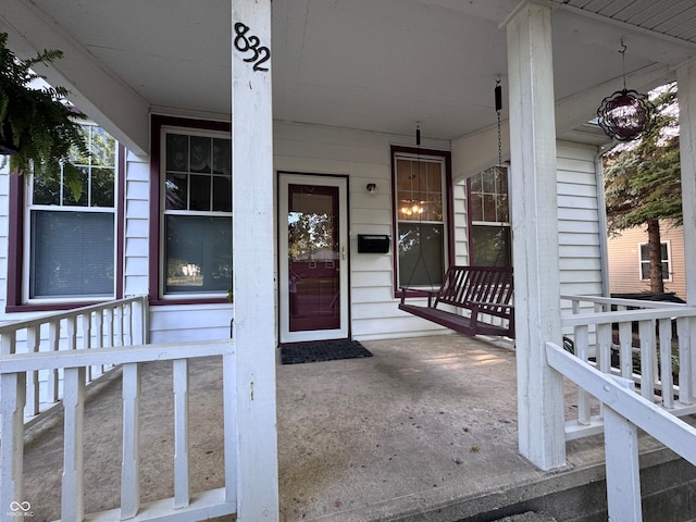 doorway to property featuring a porch