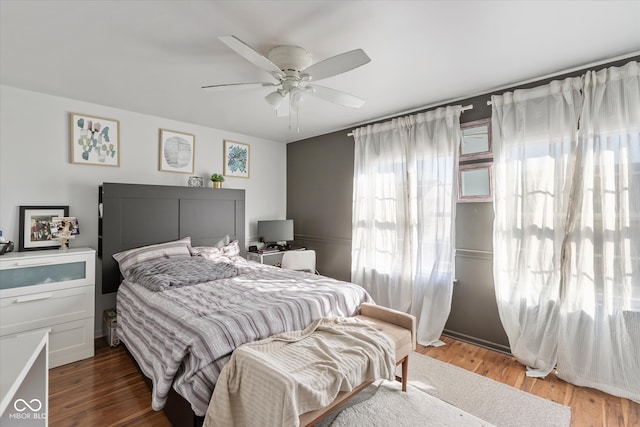 bedroom featuring ceiling fan and wood-type flooring